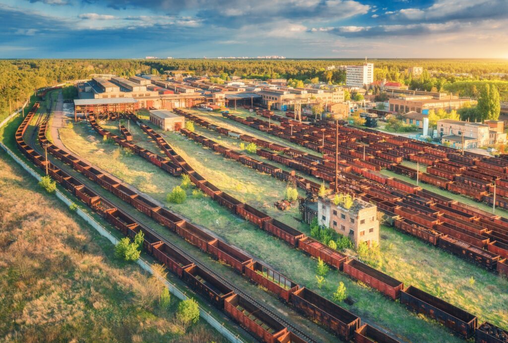 Aerial view of colorful freight trains. Railway station